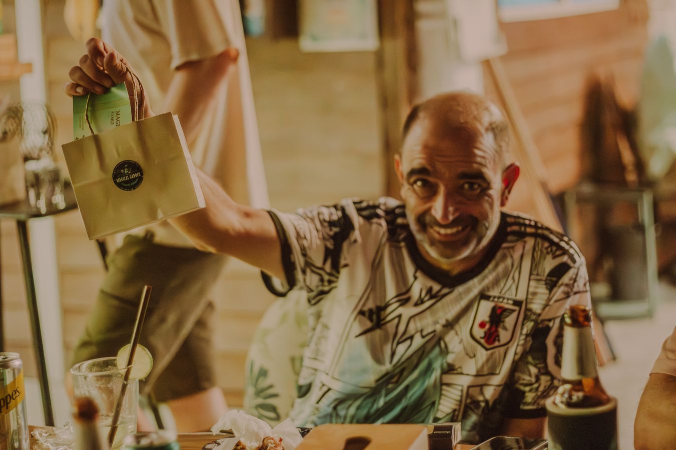 Customer with cannabis bag smiling